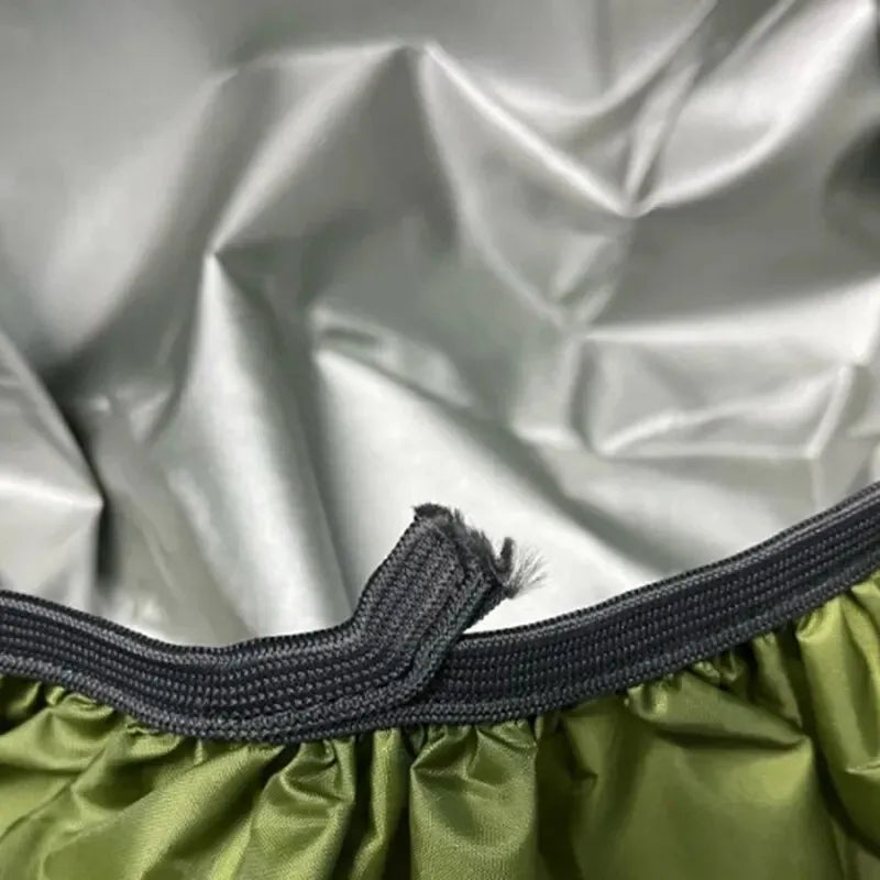 Close-up of a green fabric with a black elastic band